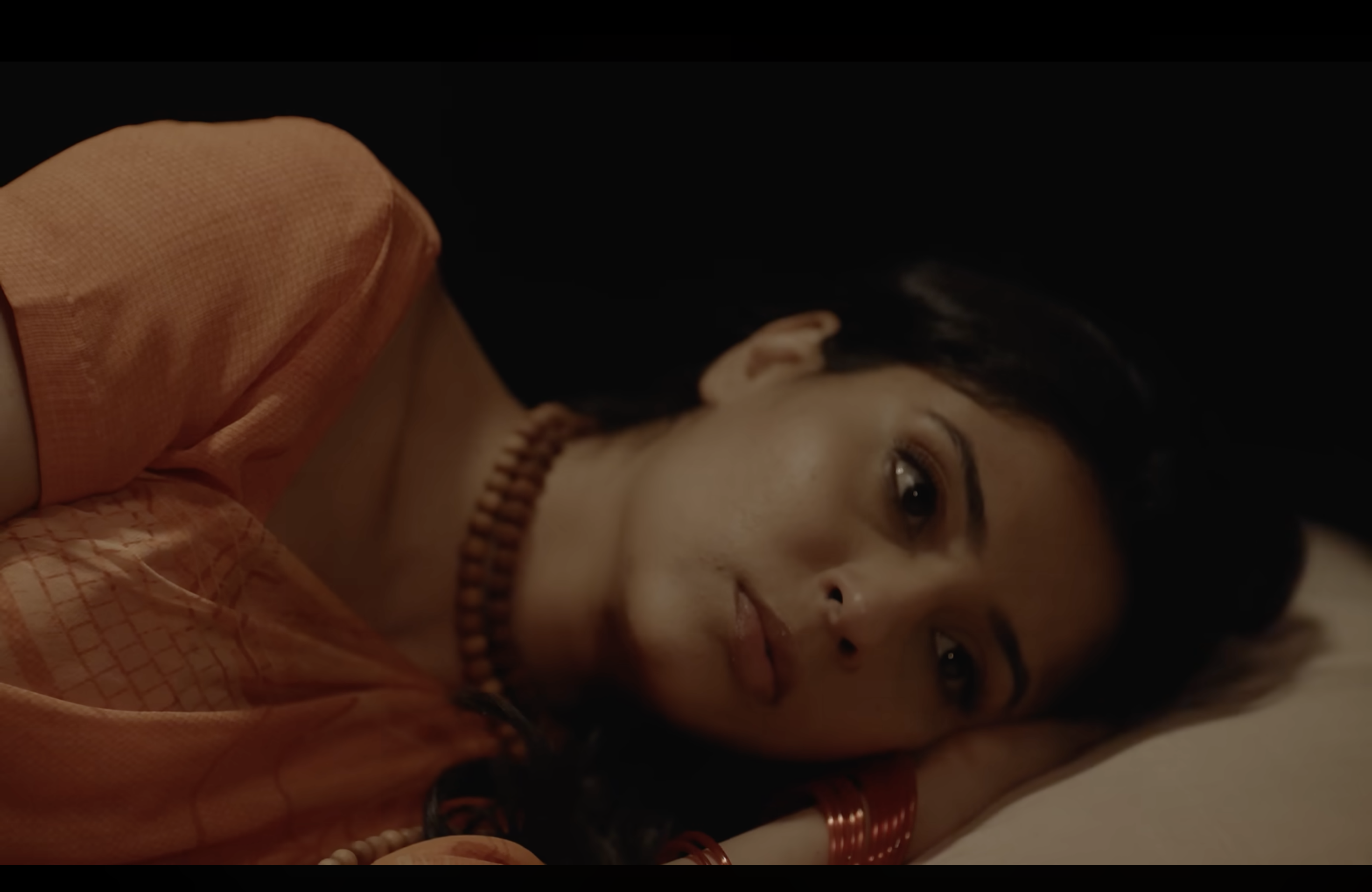 Kaahe Jaage Mohan: A woman lying on her side