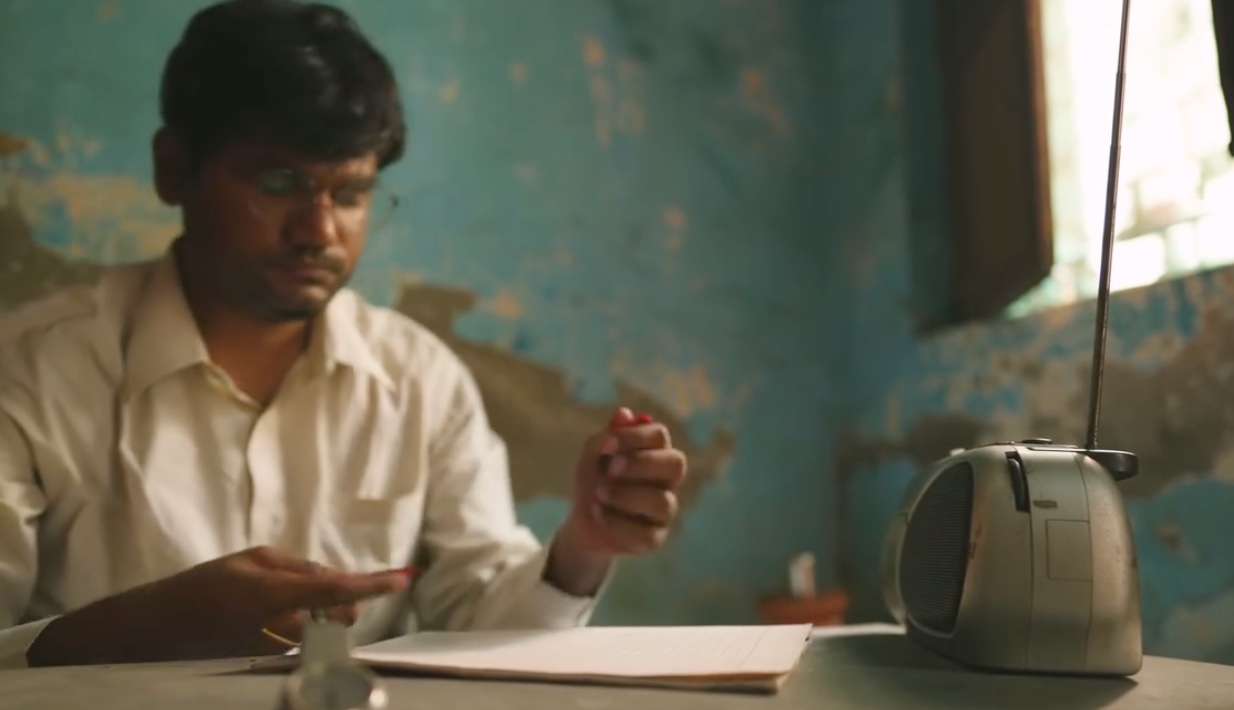 The Locked Doors of Delhi - 6: A man seated at a table