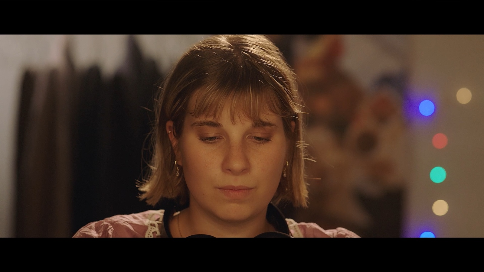 Between Worlds: A woman in a softly lit bar