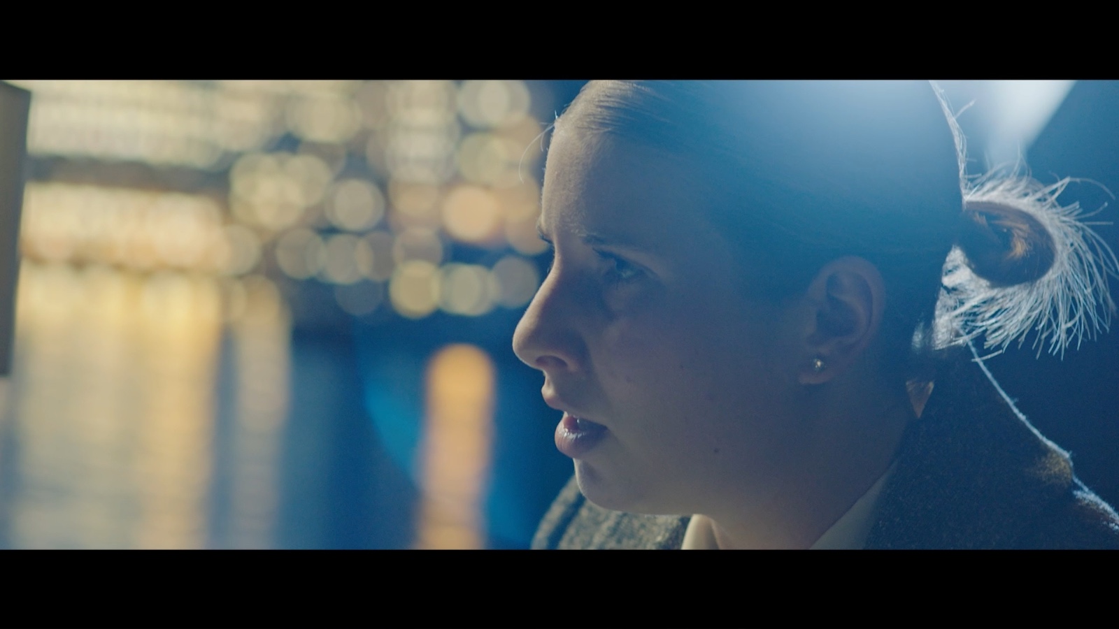 Between Worlds: Profile of a woman in cool light