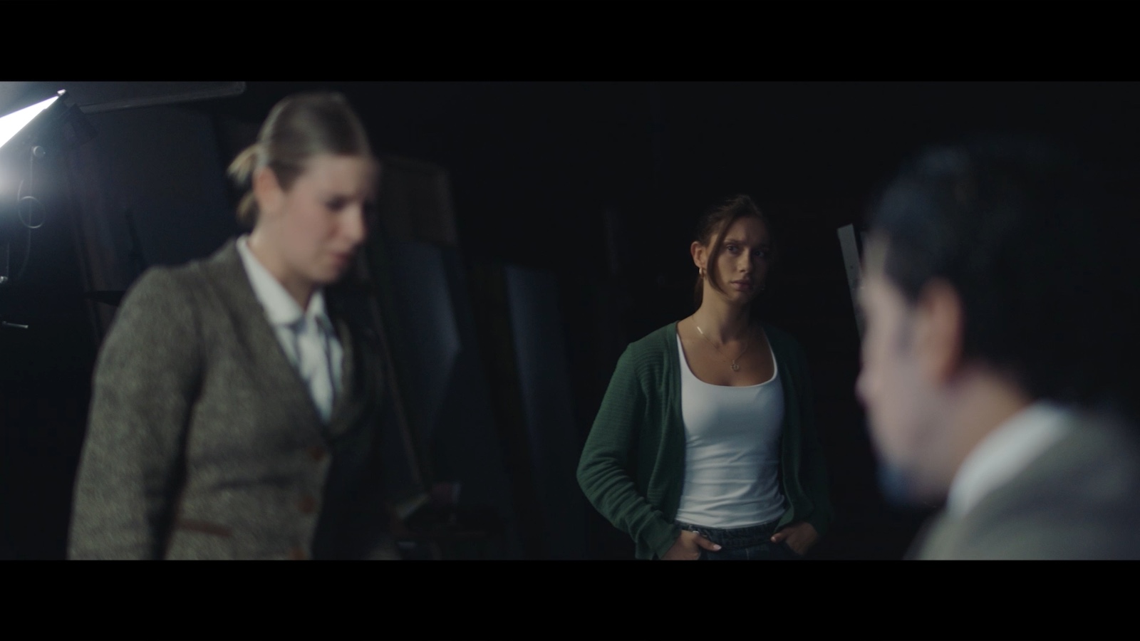 Between Worlds: Two women facing a desk