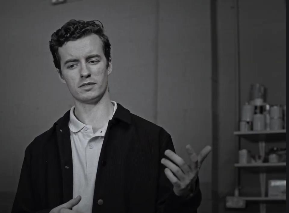Find My Phone: A man speaking indoors