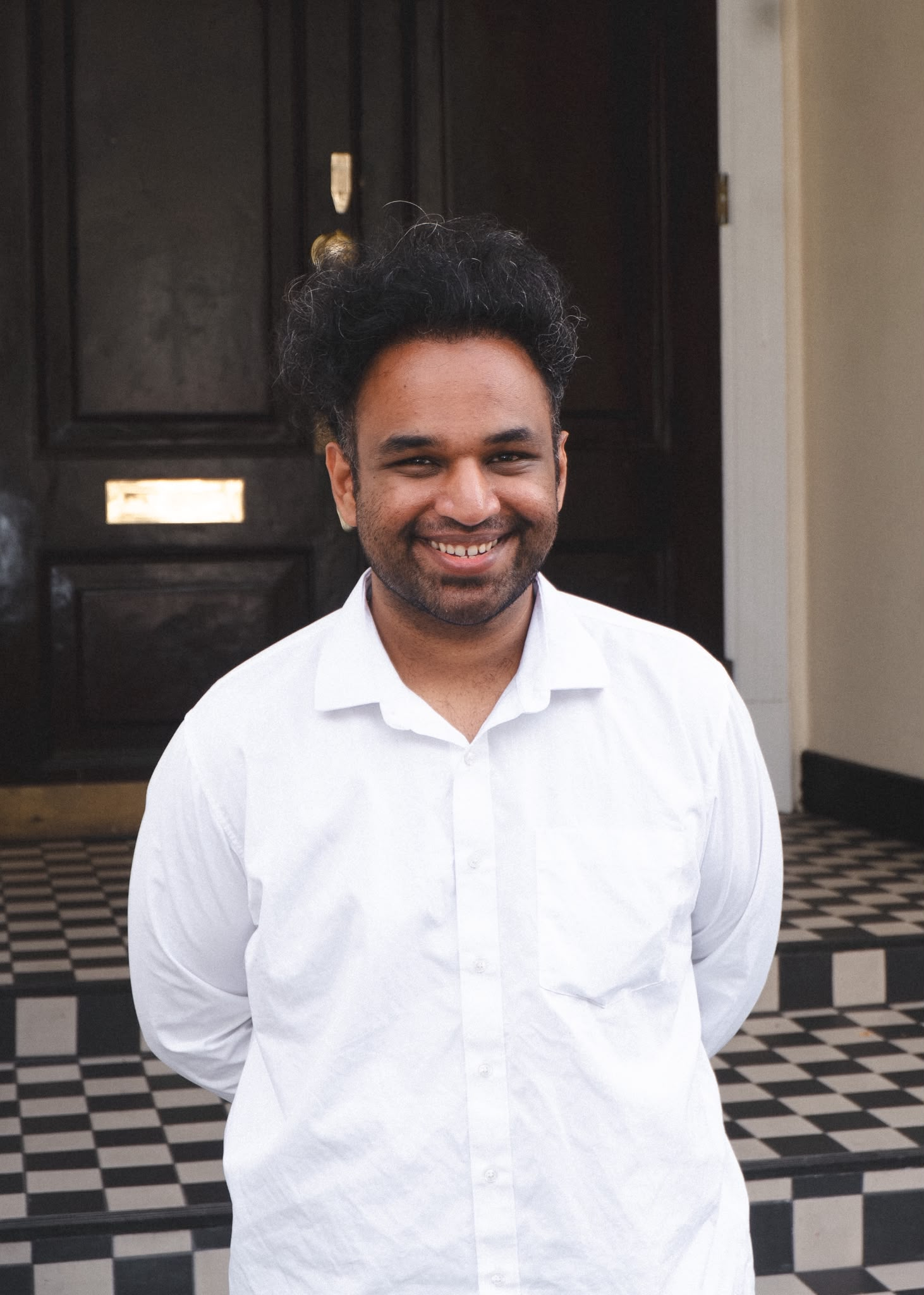Prakhar Gautam smiling in a white shirt