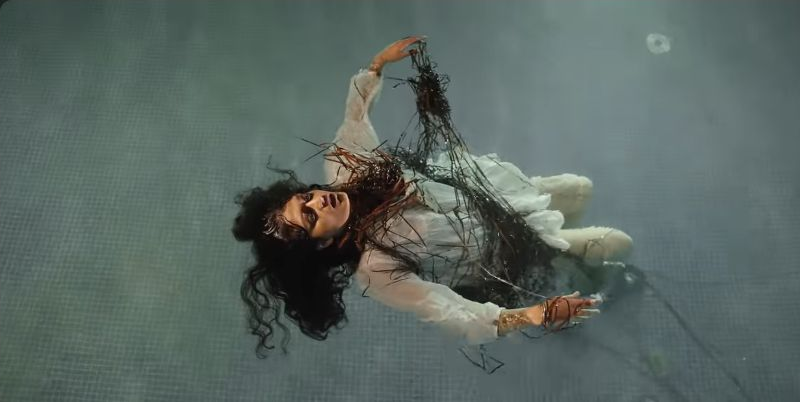 Choke: A woman floating in water
